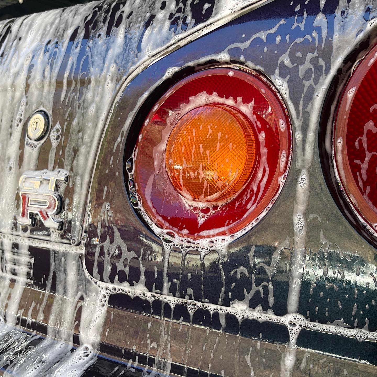 Nissan GT-R being hand washed during a detail